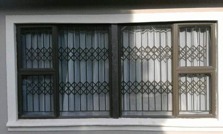Expandable diamond-trellis burglar guards fitted to window openings
