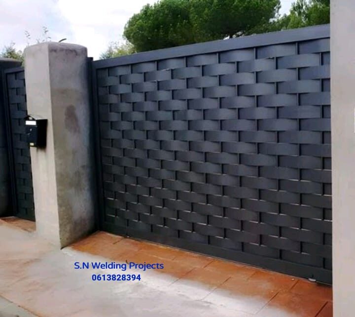 Woven palisade gate matching the fence line