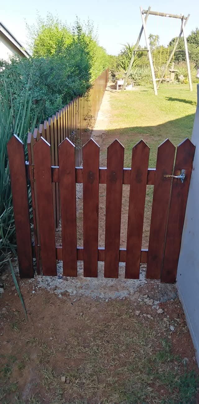 Timber picket fencing and matching garden gate