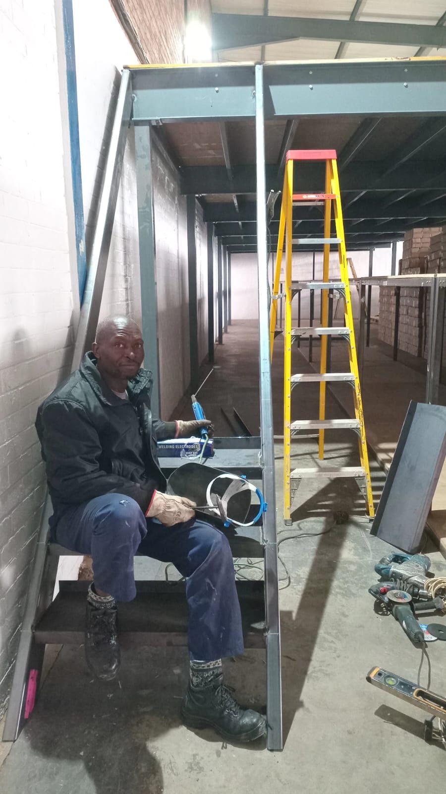 SN Welding Projects fabricator on site during a steel mezzanine build